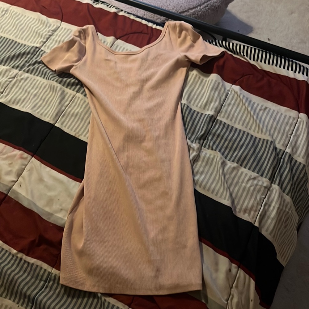 A nude pink bodycon dress
